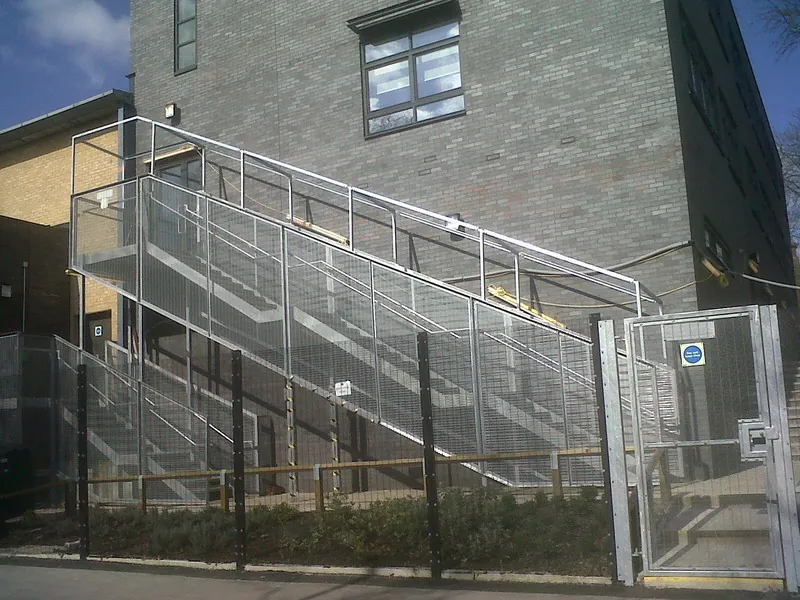 Steel stairs with a security enclosure at East Surrey College
